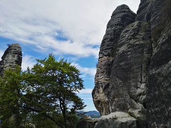 Low angle view of rock formation against sky