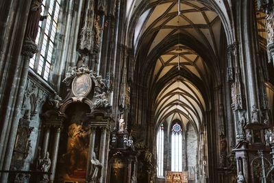 Low angle view of stained glass window in temple