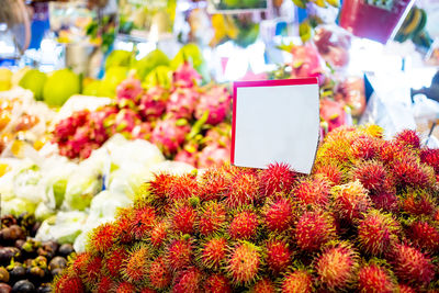 Various flowers for sale at market stall