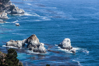 High angle view of rocks in sea