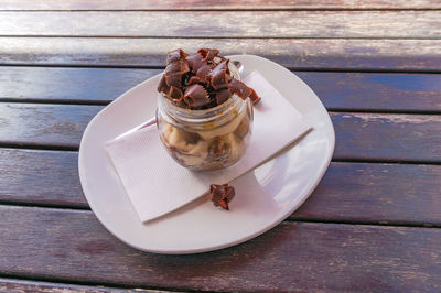 High angle view of chocolate cake in plate on table