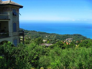 Scenic view of sea and buildings against sky