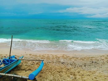 Scenic view of sea shore against sky