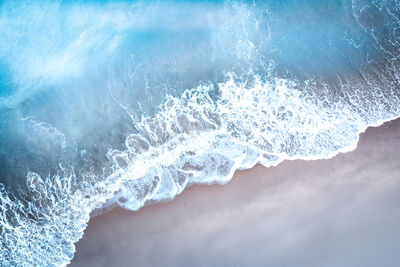 Close-up of wave splashing on sea