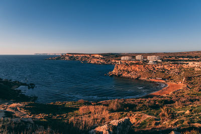 Aerial view of sea against clear sky
