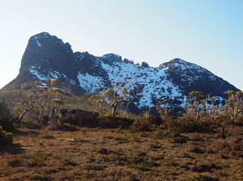 Scenic view of snowcapped mountains against clear sky