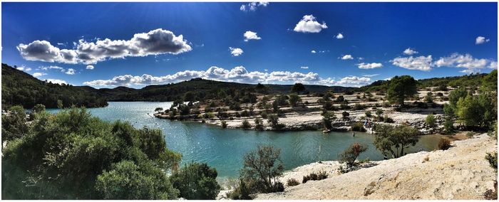 Scenic view of lake against cloudy sky