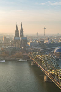 Bridge over river with buildings in background