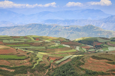 High angle view of agricultural field against cloudy sky