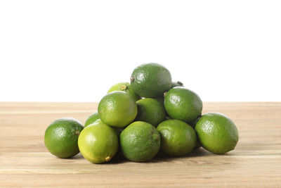 Close-up of green fruits on table