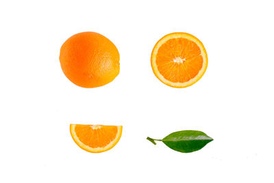 Close-up of orange fruit against white background