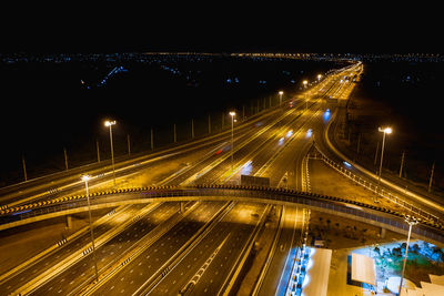 High angle view of light trails on road at night