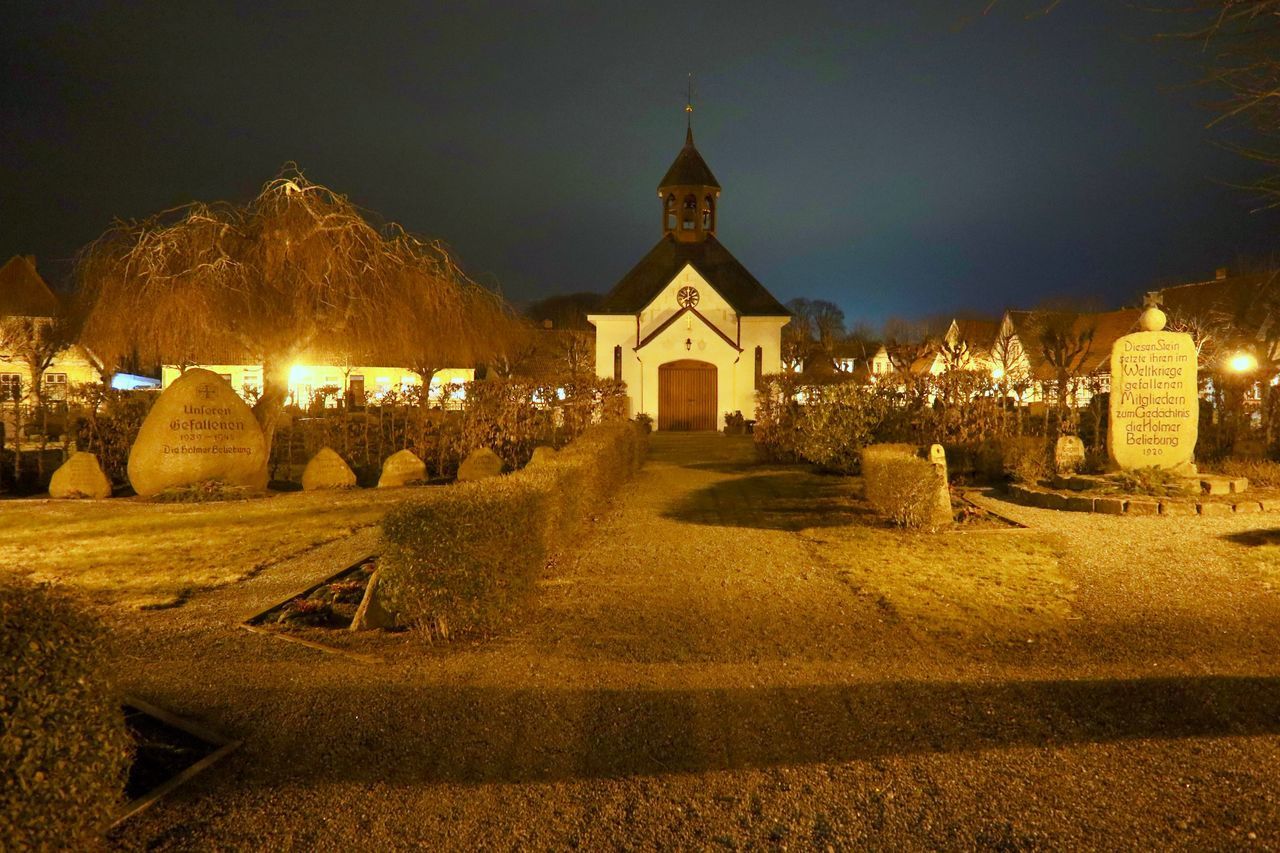 ILLUMINATED BUILDING AT NIGHT