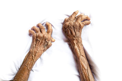 Low angle view of woman hand over white background