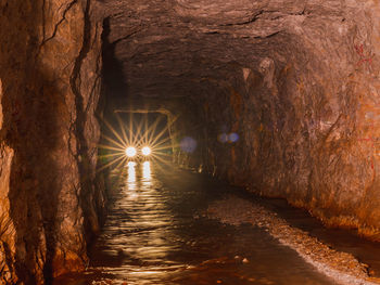 Illuminated tunnel in cave