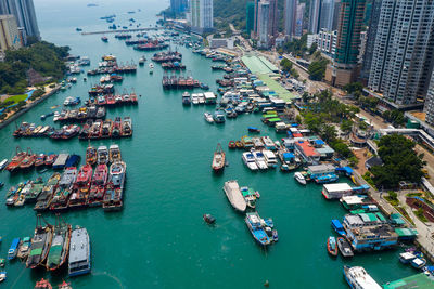 High angle view of boats moored at harbor