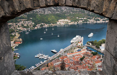 High angle view of townscape by sea