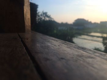 Close-up of wood against sky at sunset