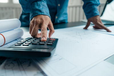 Close-up of man working on table