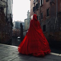 Rear view of women walking on street in city