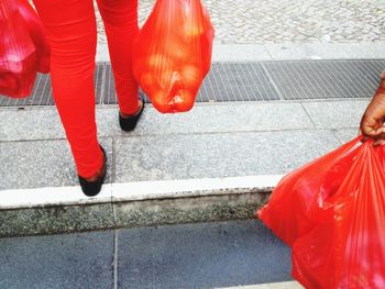 Low section of woman standing on tiled floor