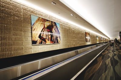 People on escalator at subway station