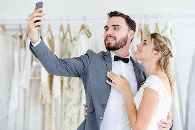 Young couple holding smart phone