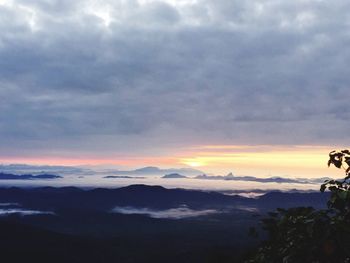 Scenic view of dramatic sky over landscape during sunset