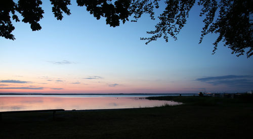 Scenic view of sea against sky at sunset