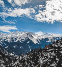 Scenic view of snowcapped mountains against sky