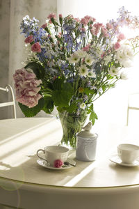 Flower vase on table