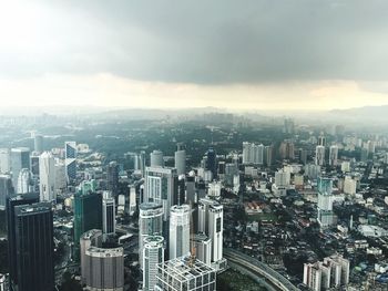 High angle view of modern buildings in city against sky