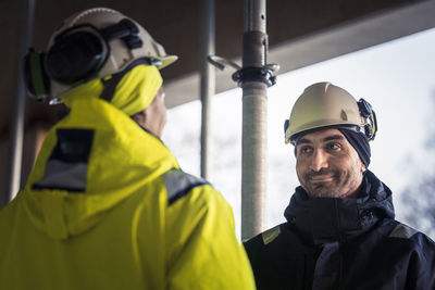 Engineers talking at building site