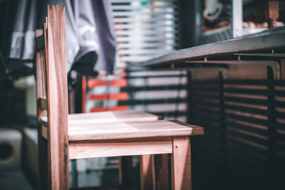 Close-up of empty chairs and table in cafe