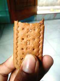 Close-up of hand holding bread