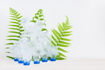 Close-up of christmas decorations over white background