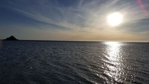 Scenic view of sea against sky at sunset