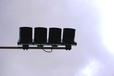 Low angle view of floodlight against blue sky