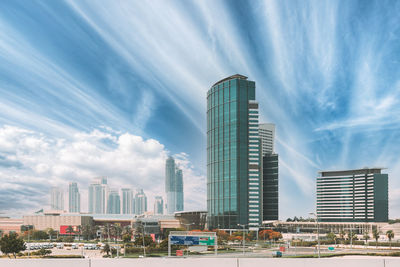 Modern buildings in city against sky