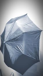 Low angle view of umbrella against white background