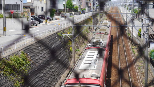 High angle view of train on railroad tracks in city