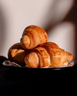 Close-up of croissant on table