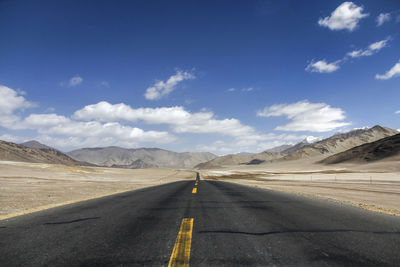 Empty road against sky