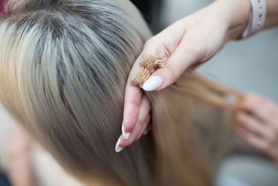 Close-up of woman holding hands