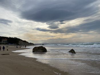 Scenic view of beach against sky during sunset