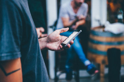 Close-up of man using mobile phone