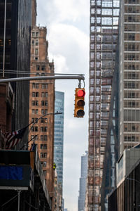 Low angle view of buildings in city against sky