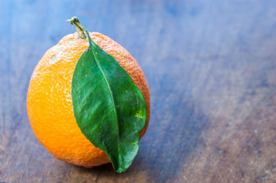 Close-up of orange fruit on table