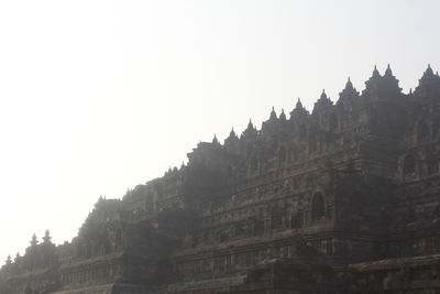 Low angle view of buildings against clear sky