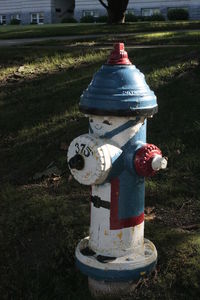 Close-up of fire hydrant on field against sky